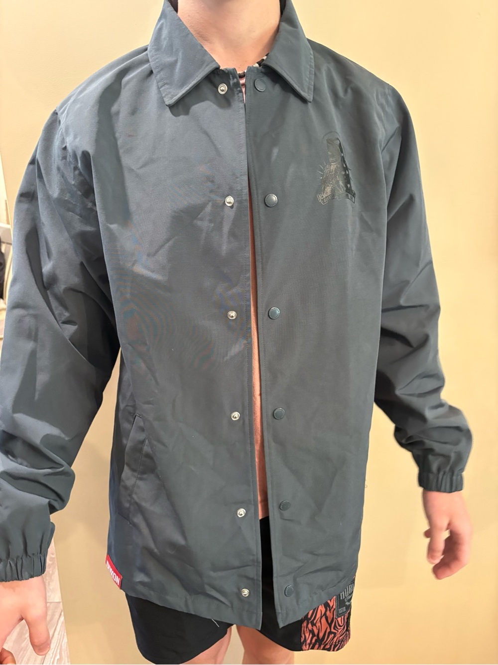 DIXXON Men's Windbreaker Jacket in Dark Gray with insignia imprinted